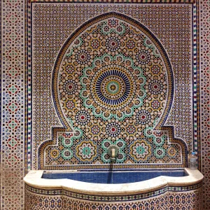 Moroccan public mosaic fountains made by zellige Moroccan public mosaic fountains featuring intricate geometric patterns crafted from hand-cut mosaic tiles, zellige